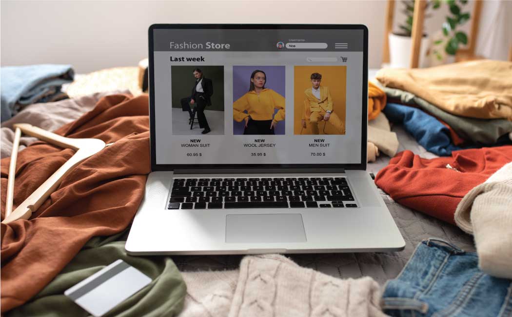 Laptop screen displays a fashion store website