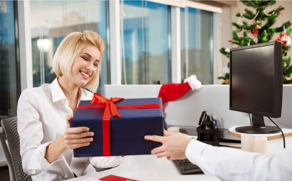 A person receiving a gift in an office