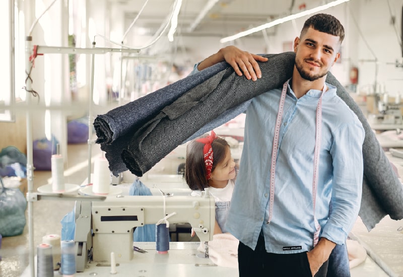 Apparel company, and a person is holding a fabric