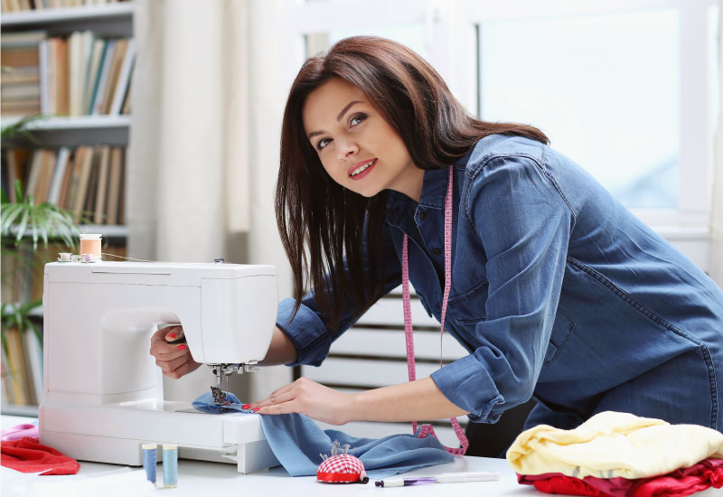 A person using a sewing machine