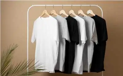 A variety of t-shirts hanging on a rack