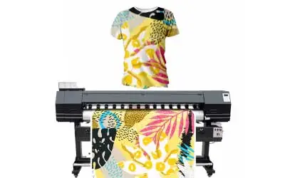 A t-shirt sitting next to a large sublimation printer