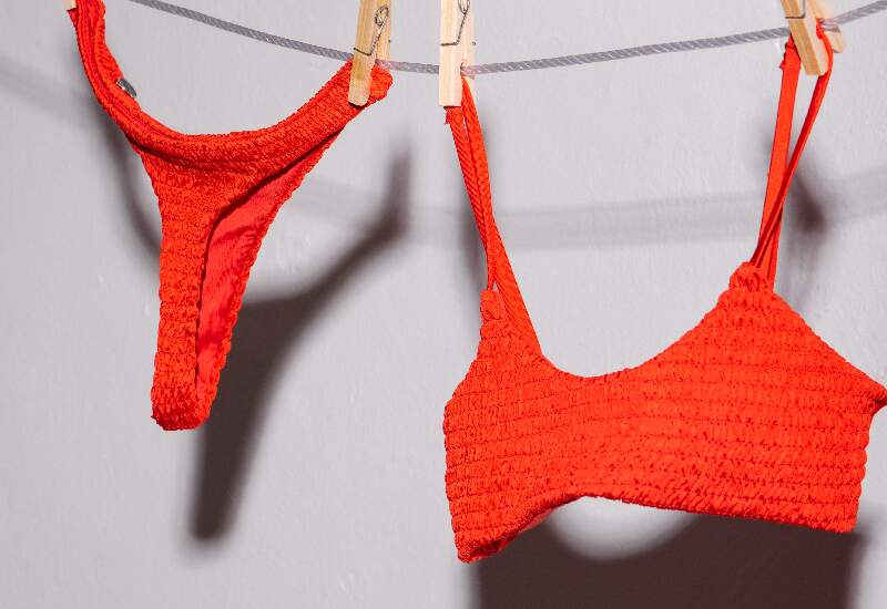 Red bra and thong hanging on a clothesline 