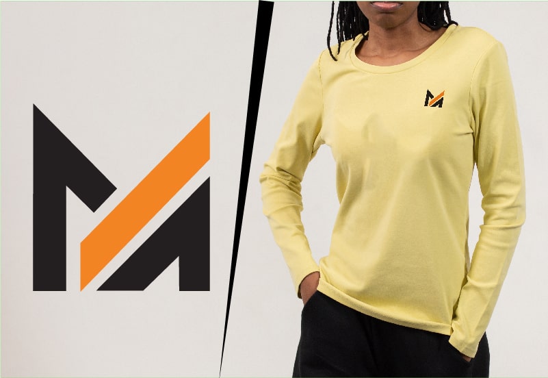 Woman wearing a yellow long sleeve t-shirt with the Mega Apparel logo